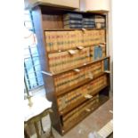 A 1.41m 20th Century oak six shelf stepped open bookcase with moulding to centre