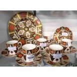 An Abbeydale bone china part coffee set comprising six cans and saucers (one can a/f) - sold with