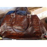 A quantity of leather and other handbags including Paul Smith, Carl Scarpa, Barbour, etc.