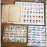 Two framed sets of cigarette cards, board mounted set of stuck down automobile cards and some