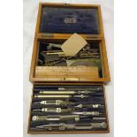 A early 20th Century oak cased set of drawing instruments by J. Coombes of Devonport and named to