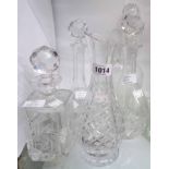 Four assorted decanters including ship type, Edwardian claret jug, and an Edinburgh Crystal carafe