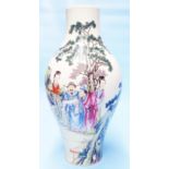 A 20th Century Chinese baluster vase decorated all round in enamel with figures in a garden