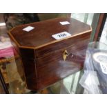 An early 19th Century stripped rosewood and boxwood strung twin compartment tea caddy with remains