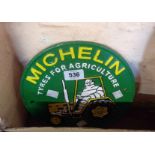 A reproduction painted cast metal Michelin tyres for agriculture sign