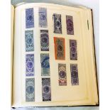A red Simplex stamp album containing a collection of Victorian and other revenue stamps including