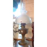 An Aladdin brass table oil lamp with chimney and shade