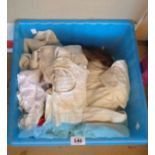 A box of assorted vintage and antique child's dresses, clothing, etc.