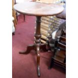 A 46cm diameter 19th Century mahogany pedestal wine table, set on turned pillar and tripod base -