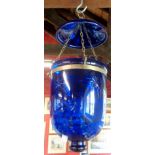 A blue glass hanging ceiling lamp with star cut decoration and gilt metal mounts