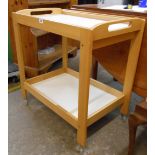 A modern Habitat tray top two tier tea trolley, set on clear casters