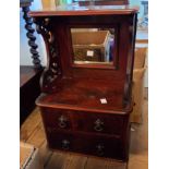 A 32cm Victorian flame mahogany vanity unit with mirror set back, flanking fretwork brackets and two