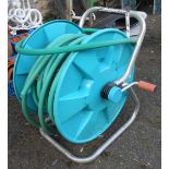 A Gardena garden hose on reel