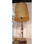 A vintage teak and brass table lamp with shade