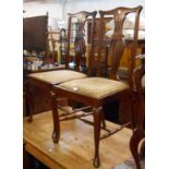 Three matching Edwardian walnut framed high back dining chairs with pierced splat backs and drop-