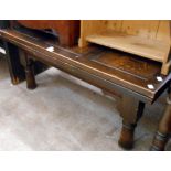 A 20th Century oak drawer leaf dining table - as a coffee table