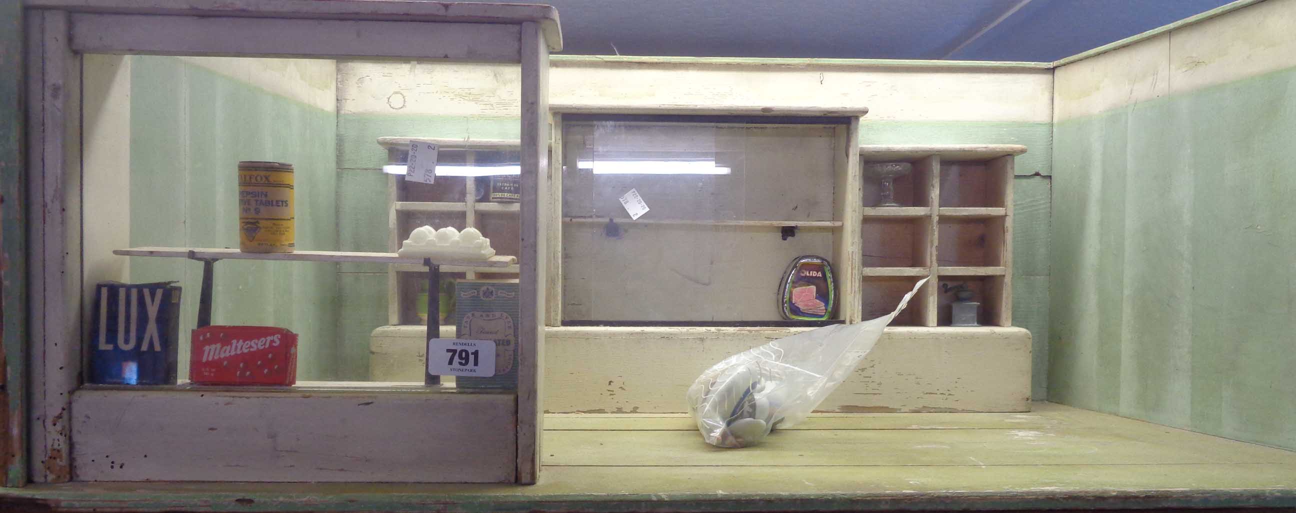 A vintage scratch made doll's Grocer's shop - sold with miniature items of packaging including