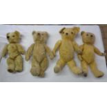A box containing four old Teddy bears - various condition
