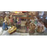 A vintage nine piece painted plaster nativity - sold with an associated carved wood king and three