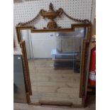 A 61.5cm vintage Georgian style gilt framed wall mirror with vase and swag pediment and stepped