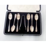 A cased set of six Sheffield silver rat tail coffee spoons and sugar tongs - all 1910 except for one