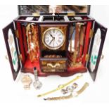 A decorative plastic musical jewellery cabinet with quartz timepiece, containing a quantity of