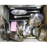 A box containing a large quantity of silver plated cutlery, hand mirror, three dishes and wine