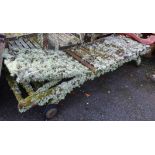 A Barlow Tyrie teak sun lounger covered in lichen
