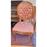 A 20th Century giltwood framed standard chair with button back upholstery, set on turned and