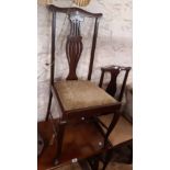 Three matching Edwardian walnut framed high back dining chairs with pierced splats and drop-in