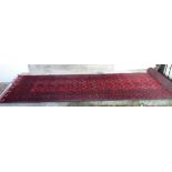 A wool Bokhara runner - 85cm X 278cm