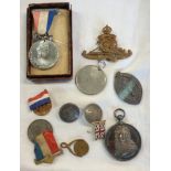 A silver Brodrick Medal for The Bath Blue Coat School - sold with a Royal Artillery cap badge, two