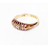 A hallmarked 18ct. gold five stone small diamond ring