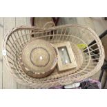 A wicker Moses basket containing woven baskets, small pine cupboard, etc.