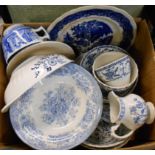 A box containing blue and white china