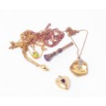 A marked 18ct heart shaped red stone set pendant - sold with yellow metals chains, scent locket,