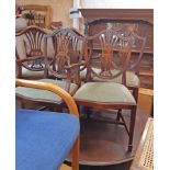 A set of six reproduction mahogany framed shield back dining chairs with wheatsheaf decoration and