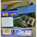 A collection of vintage Hornby three rail track and related items including Left and Right Points,