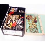 A mirrored box and small wooden box containing a quantity of assorted costume jewellery