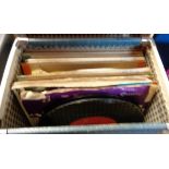 A record case containing small selection of vinyl 45rpm singles, mainly dance band