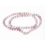 A string of modern lilac coloured cultured pearls with decorative magnetic clasp