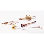 A marked 15ct horseshoe stick pin, hunting horn brooch and two Stratton sporting tie clips