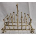 A silver plated toast rack after a Christopher Dresser design with stepped ball and stick dividers