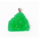 A carved jade seated Buddah pattern pendant with yellow metal suspender loop