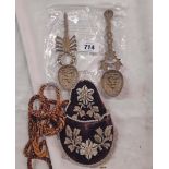 Two Eastern silver plated brass spoons and a beaded pouch