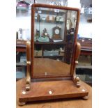 A 56cm Victorian platform dressing table mirror with bevelled oblong plate and scroll supports,