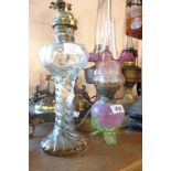 A Victorian cranberry and opaline North Country style glass oil lamp and similar shade - sold with a