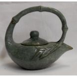 A Chinese carved hardstone teapot with continuous bamboo handle and lid