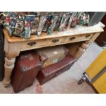 A 105cm Victorian waxed pine kitchen table with two frieze drawers, set on turned legs