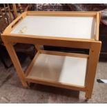 A modern Habitat tray top two tier tea trolley, set on clear casters